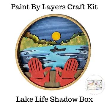 Layered craft kit showing lake scene with red gloves and a canoe.