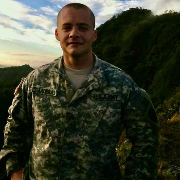 Photo of CEO Bruce Cardenas on mountain taken while stationed in Hawaii.