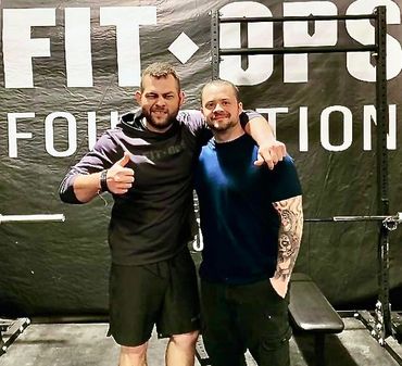 Photo of CEO Bruce Cardenas with FItOps graduate.