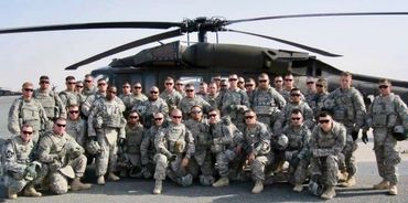 Group photo of Unit 1-21 Bravo Company. aka the "Gimlets."