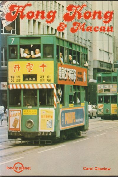 Double-decker trams in Hong Kong street scene.