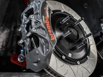 Close-up of a Brembo brake caliper and rotor.