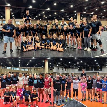 Large group of young wrestlers and coaches posing indoors at a wrestling event.