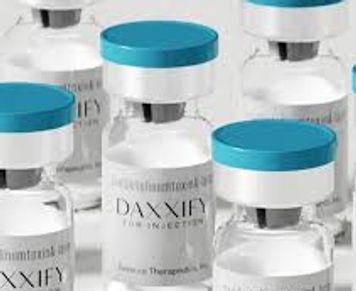 Vials of Daxxify injectable treatment with blue caps.