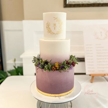 3 tier cake with aubergine and white ombré, personalised monogram and fresh floral wreath