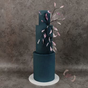 3 tier navy cake with lilac wafer foliage