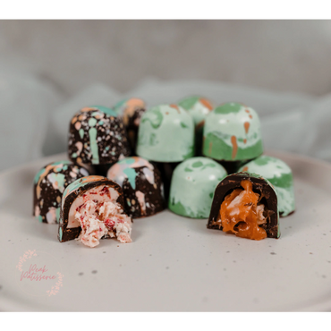 Chocolate bon bons, raspberry and white chocolate and salted caramel and apple