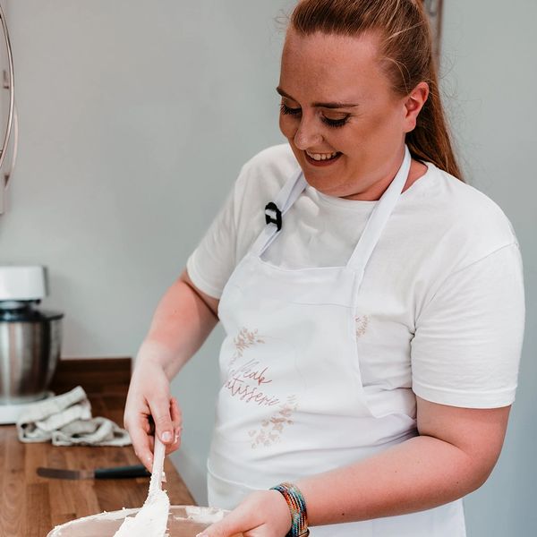 Owner mixing buttercream