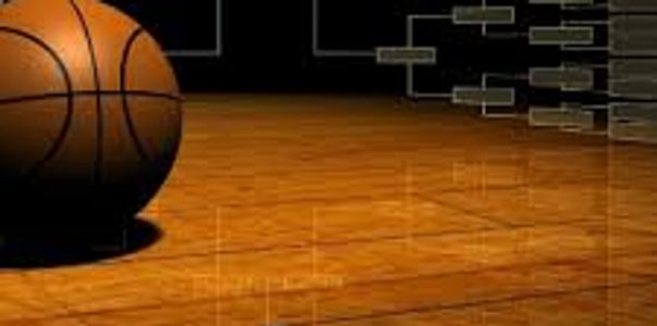 basketball with tournament brackets in the background