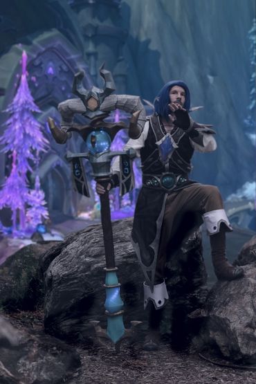 Kalecgos cosplay full body shot with Photoshop edited background and Dragonwrath staff