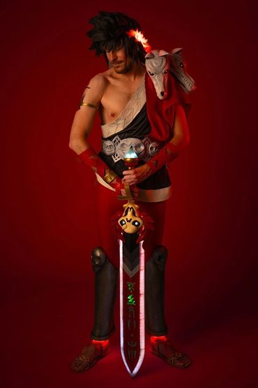 Fully body shot of Zagreus cosplay showing LEDs on feet and crown, as well as in 3d printed sword