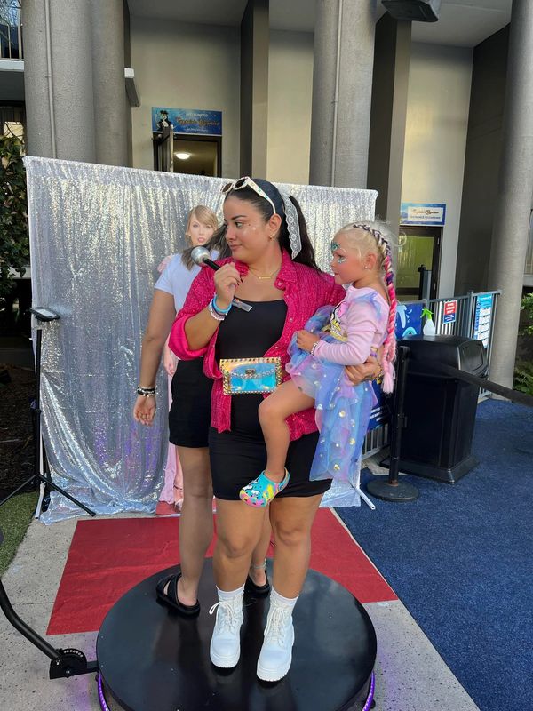 lady with photo props on the 360 photo booth or 360 photo booth