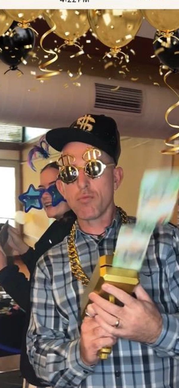 Man and lady with photo props on the 360 photo booth or 360 video booth