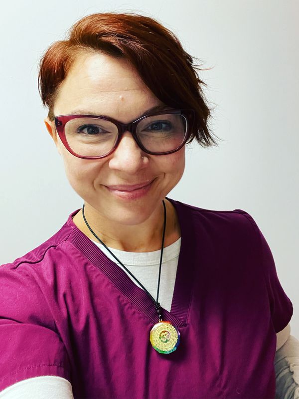smiling woman with glasses and short hair