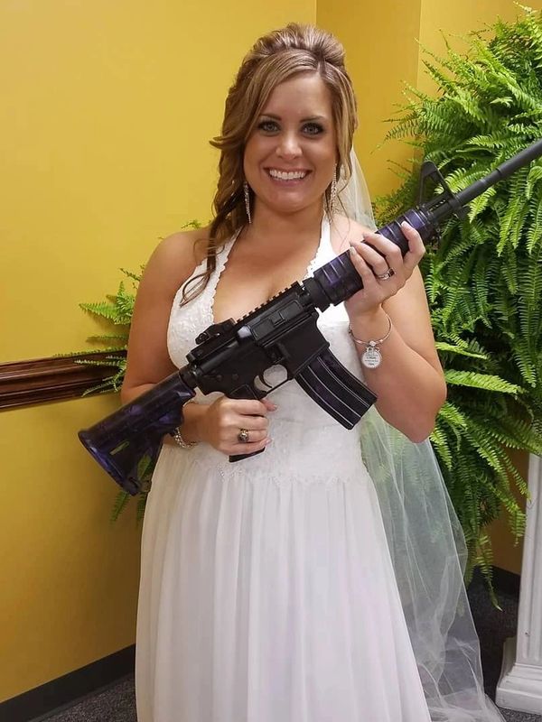 woman in wedding dress holding AR