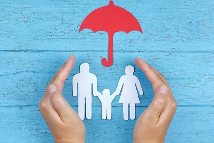 umbrella protecting a family