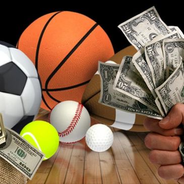 Various sports balls with cash representing sports betting or earnings.