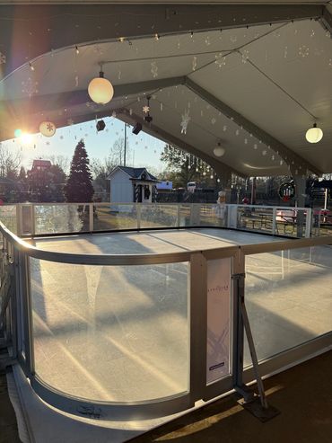 Synthetic ice surface and transparent boards beneath the pavilion.