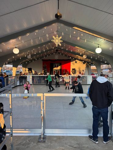 Children skating beneath the decorated Adamsville park pavilion.