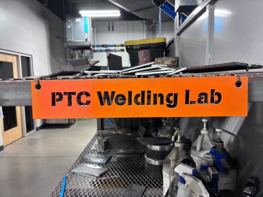Orange sign reading 'PTC Welding Lab'.
