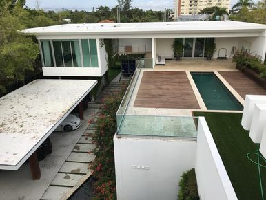 Flat Reroof project in Miami Beach community. We also added a white silicon coating to the roofs.