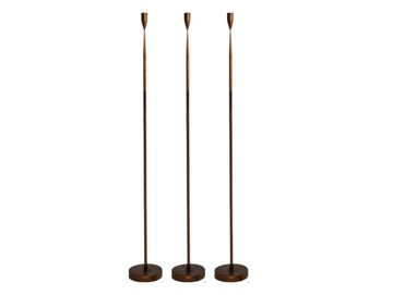 Trio of tall bronze floor candlesticks for wedding ceremony styling and event hire in Scotland