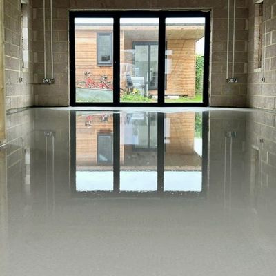 Levelling compound completed. Pictured in front of byfold doors.