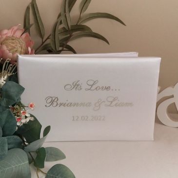 Personalised satin wedding guest book.