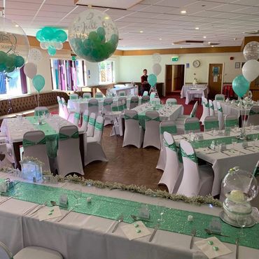 Mint green sashes, tablecloths and runners complete with balloon setup 