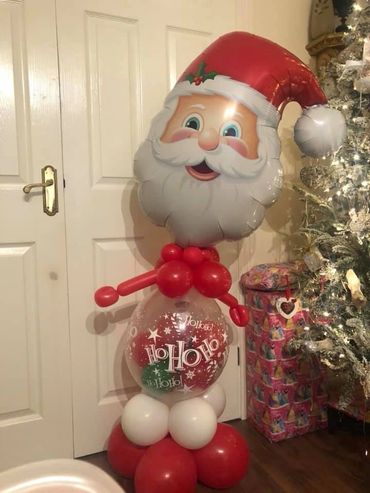 Santa stuffed balloon with balloons (can include a gift )