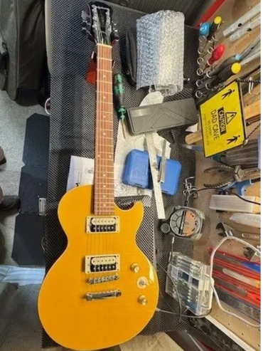 Nathans sons first guitar A brand new Epiphone les paul special in dire need of a setup