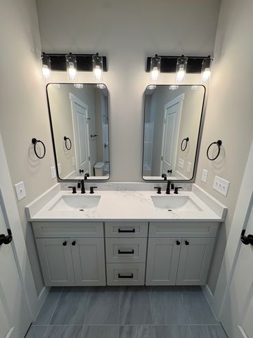 Modern double vanity bathroom with black fixtures