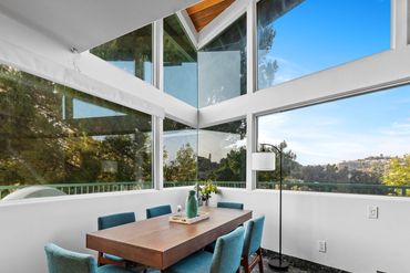 Elegant dining room table from Resource Furniture that transforms to accommodate 4 or 8 guests.