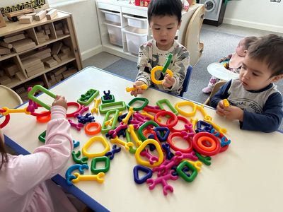 Children sitting at table with links