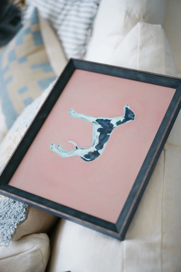 Framed abstract blue and white painting on pink canvas. Dog portrait oil painting by Polly Pincott