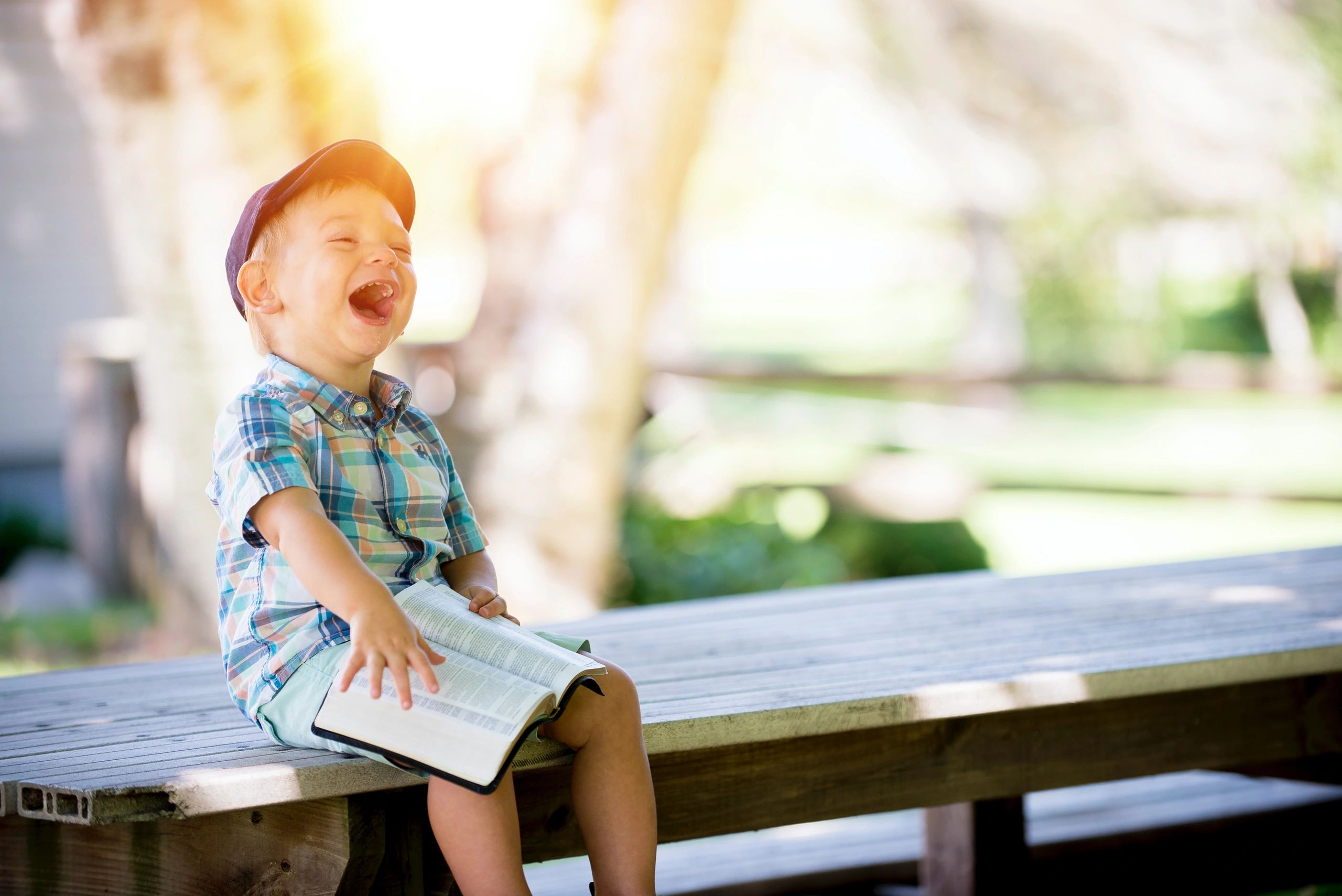Laughing young boy with Down Syndrome