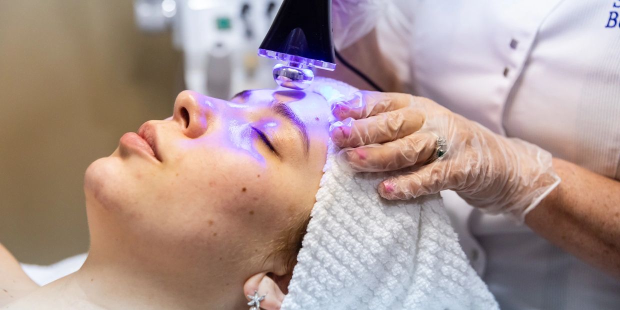 A laser machine doing skincare on a lady head