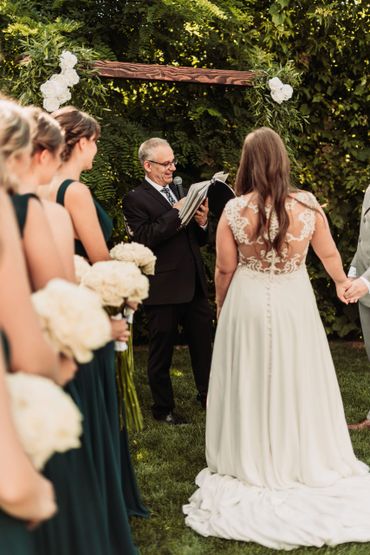 vows with bridesmaids at a wedding