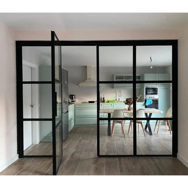 Modern kitchen with glass partition and pastel cabinets.