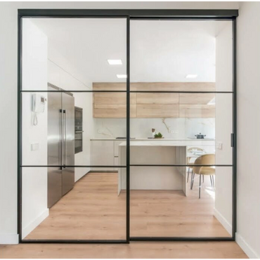 Modern kitchen with glass sliding doors and wooden flooring.
