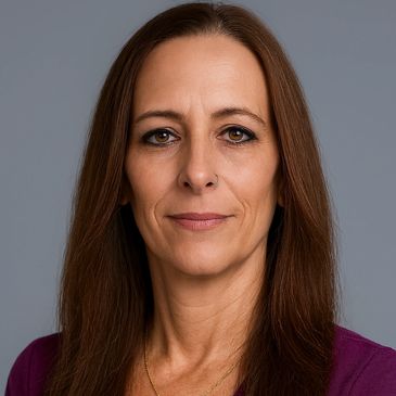 Confident woman with long brown hair and a calm expression.