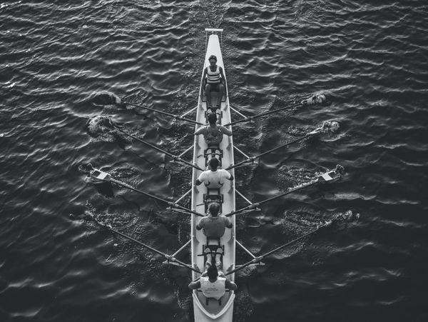Athletes sailing in a kayak on a lake