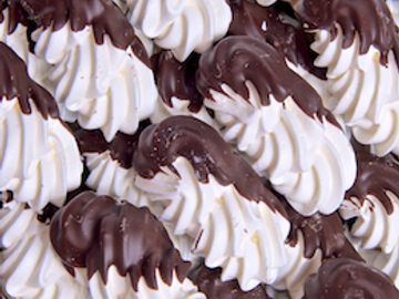 Meringue dipped with chocolate.