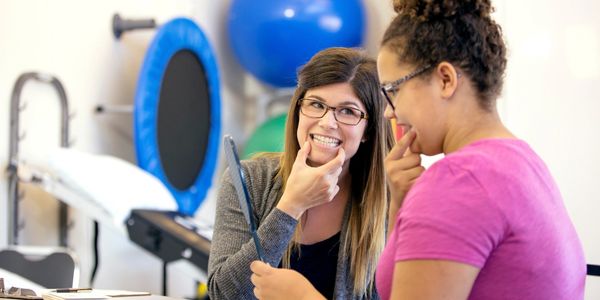 adult doing speech pathology or speech therapy