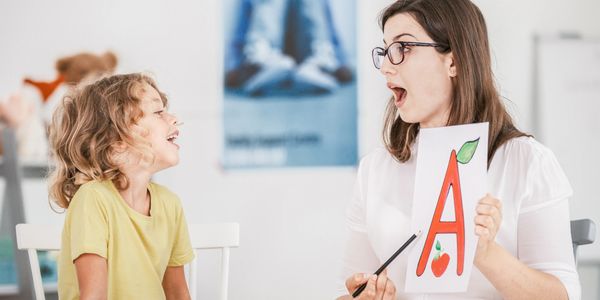 child doing speech pathology or speech therapy