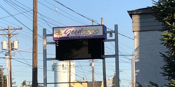 Sign for Good Hope Church of God in Christ on a clear day.