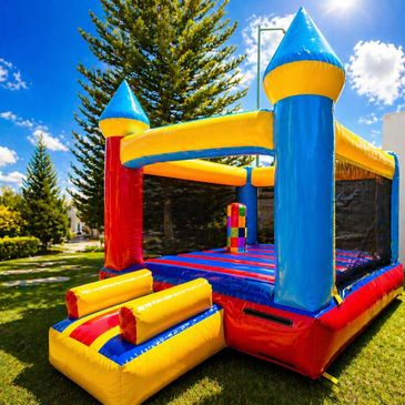 Colorful inflatable bounce house set up outdoors on a sunny day.