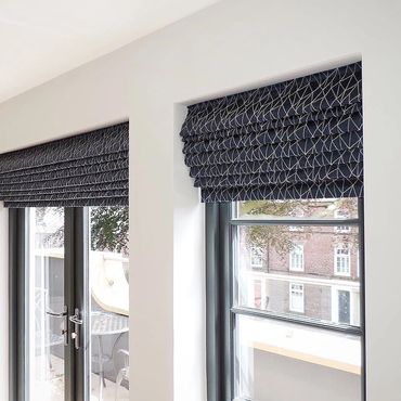 Made to measure roman blinds in window