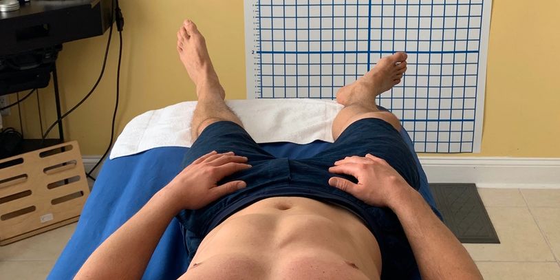 Male athlete feet out of alignment causing pain and slowness. Rolfing at Pain Relief Palm Beach, FL