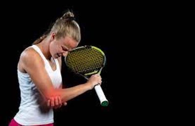Female tennis player with elbow pain. Rolfers Near Me, Rolfer Near Me, Palm Beach Pain Relief, FL.
